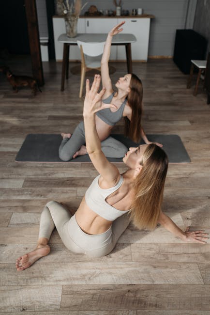 Woman in a calm yoga pose in a warmly lit room
